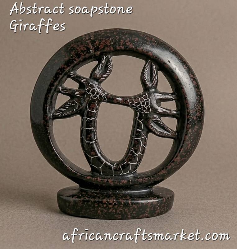 Abstract African soapstone sculpture of a giraffe couple forming a circle, hand-carved in a smooth, polished ring of love design