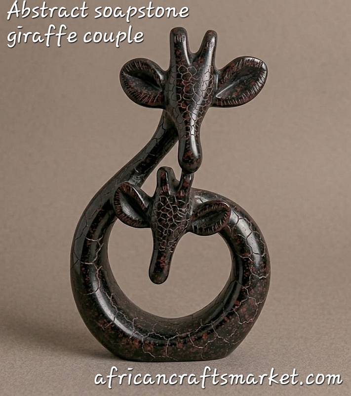 bstract African soapstone sculpture of a giraffe couple, hand-carved with smooth polished curves and minimalist features