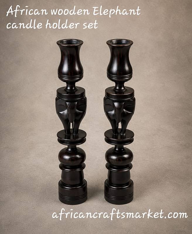 Pair of polished dark African ebony wood candle holders featuring hand-carved elephant figures integrated into the pillars