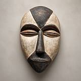 Hand carved African Galoa mask showing traditional wooden carving from Gabon