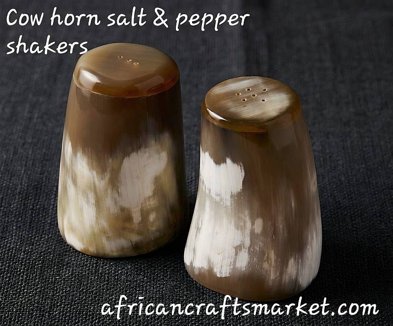 Pair of luxury African salt and pepper shakers handcrafted from highly polished natural horn with striking black and cream color gradients
