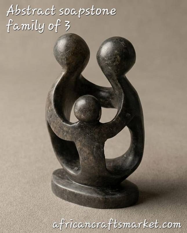 and-carved African soapstone abstract sculpture of a family of 3 with smooth, interlocking parents and child figures