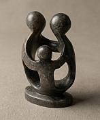 Minimalist abstract parents with one child stone sculpture, symbolizing love, security, and a new family beginning