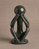 Minimalist abstract soapstone figurine of a meditating thinker, authentic handmade African cultural art