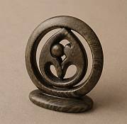 enuine handcrafted soapstone circle of friends statue showcasing the beautiful natural marbling and smooth polished texture of the stone.