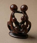 Handcrafted African soapstone unity family tree with six interlocking abstract figures, authentic global cultural art carving