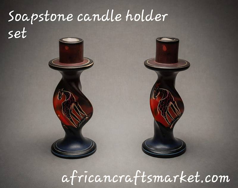 Pair of polished African soapstone twisted candlesticks hand-dyed with an earthy background and etched silhouettes of giraffes and acacia trees.