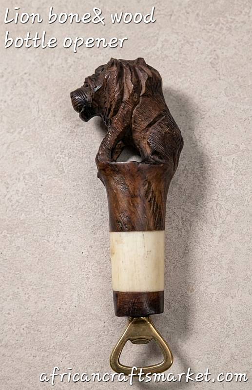A luxury handcrafted African bottle opener shaped like a lion, featuring a detailed body hand-carved from local hardwood and a face beautifully accented with polished, smooth animal bone