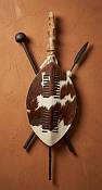 Close-up texture of the authentic hair-on-hide patterns and traditional leather lacing on a large 60cm Zulu shield from Durban