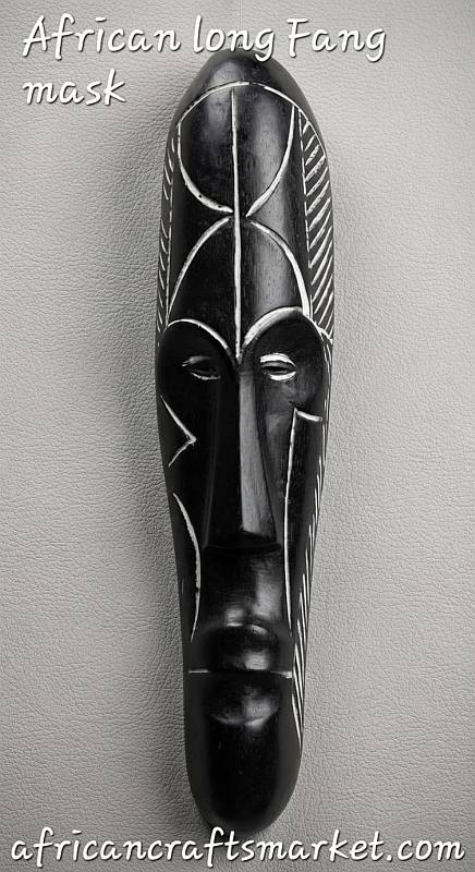 Black Fang wooden mask with carved facial details and white decoration