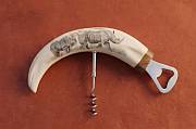 Authentic African warthog tusk bottle opener with a polished brass fitting, ideal for luxury safari bar decor