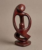 Handcrafted African stone maternity statue depicting a mother holding her baby, a unique minimalist family sculpture for contemporary home decor