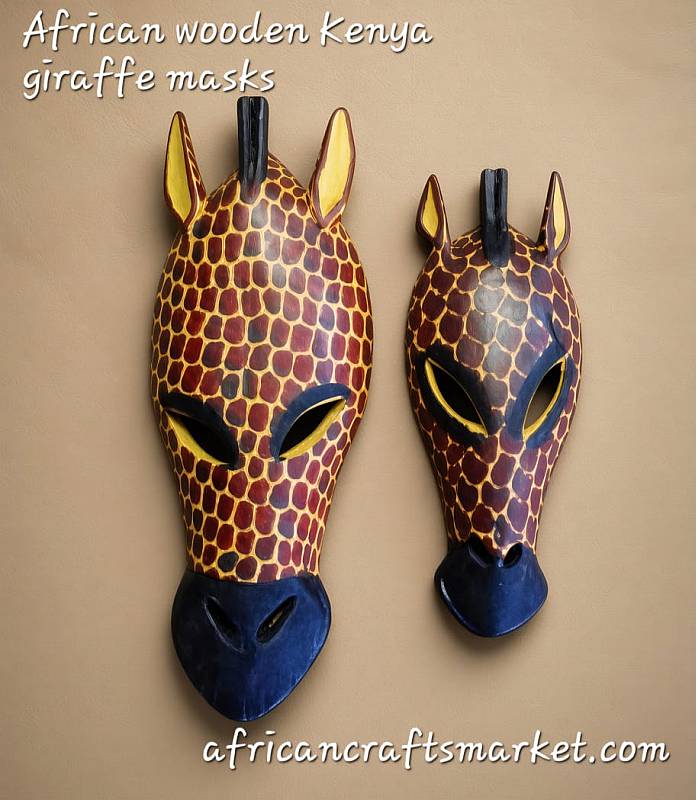 Kenyan hand carved giraffe masks Two hand carved wooden giraffe masks from Kenya