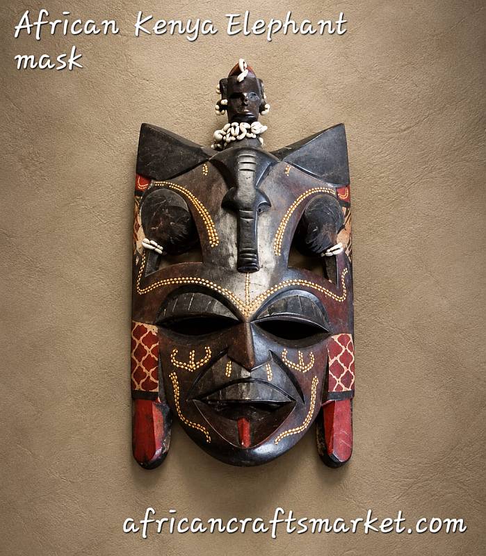 Maasai-style wooden mask with carved elephant figure from Kenya